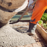 Concrete pouring during commercial concreting floors of building